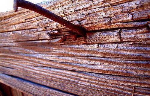A close up of some wood planks on the side of a building