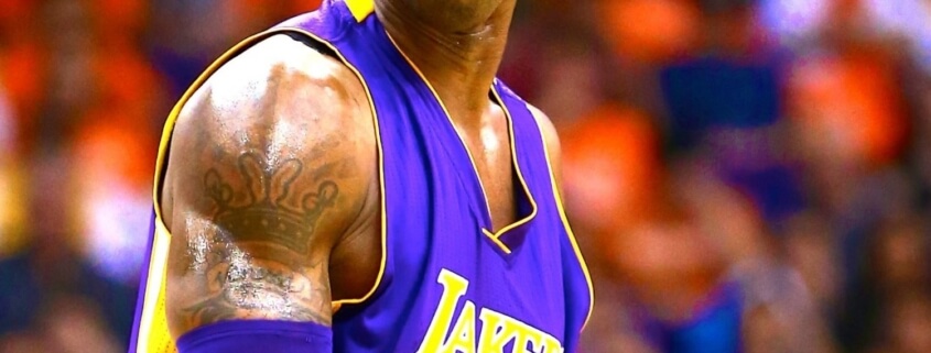 A close up of kobe bryant in front of an audience
