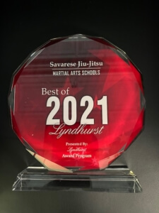 A red award sitting on top of a glass table.