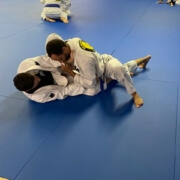 A man is doing judo on the ground