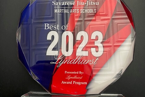 A glass award with the words " 2 0 2 3 " on it.