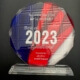 A glass award with the words " 2 0 2 3 " on it.